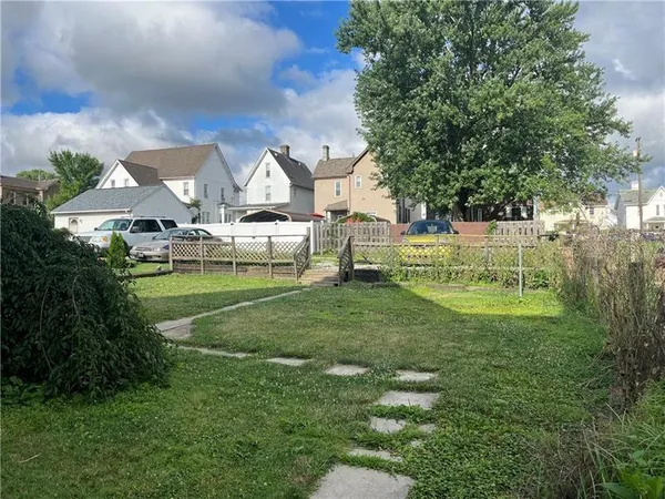 a view of house with a garden