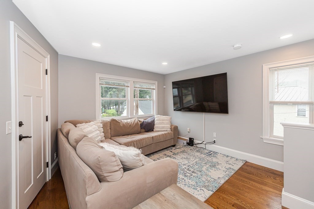 26 Foss Street, Unit 1 Medford, MA 02155 - Photo 11 of 35 a living room with furniture and a flat screen tv