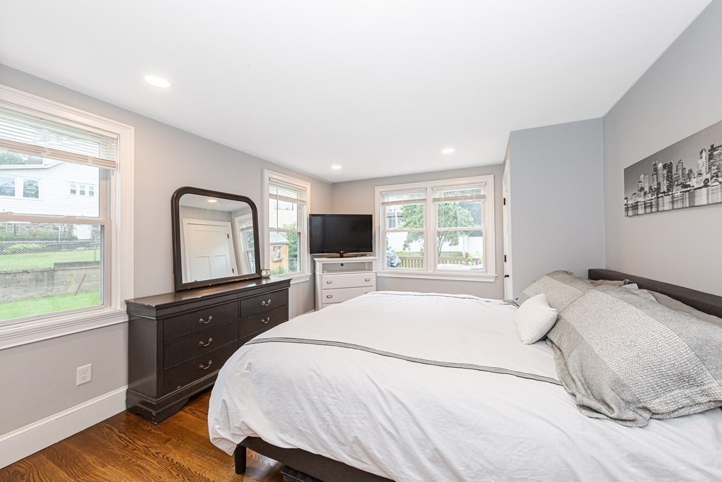 26 Foss Street, Unit 1 Medford, MA 02155 - Photo 16 of 35 a bedroom with a bed and a large window