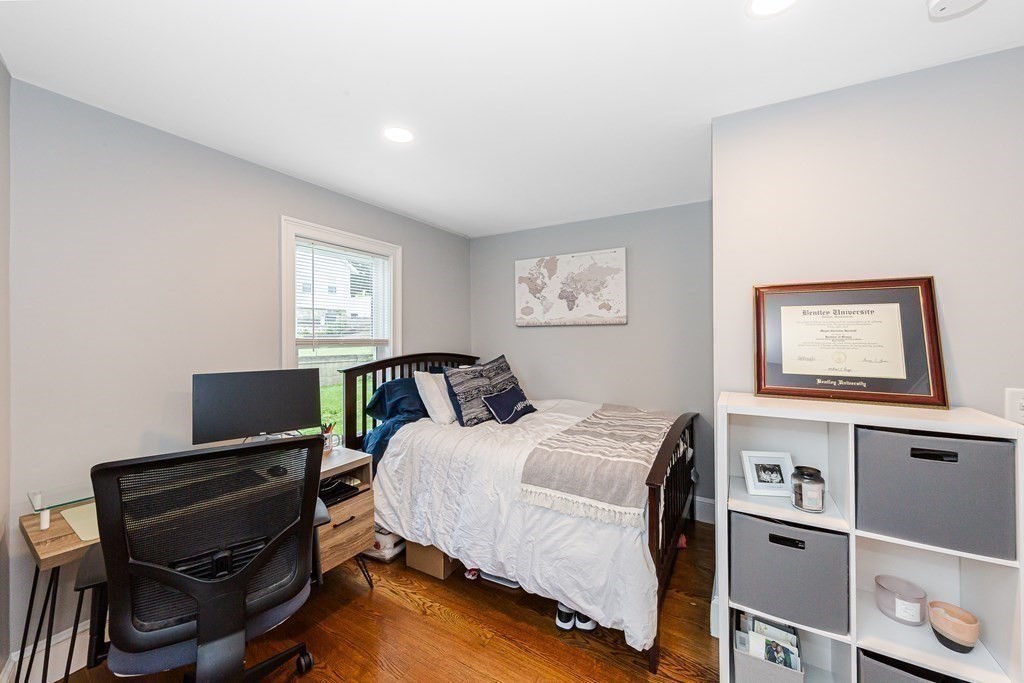 26 Foss Street, Unit 1 Medford, MA 02155 - Photo 18 of 35 a bedroom with a bed and a window