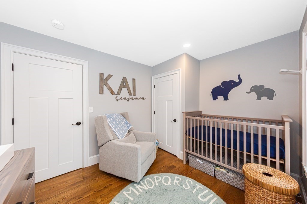 26 Foss Street, Unit 1 Medford, MA 02155 - Photo 21 of 35 a bedroom with furniture and a window