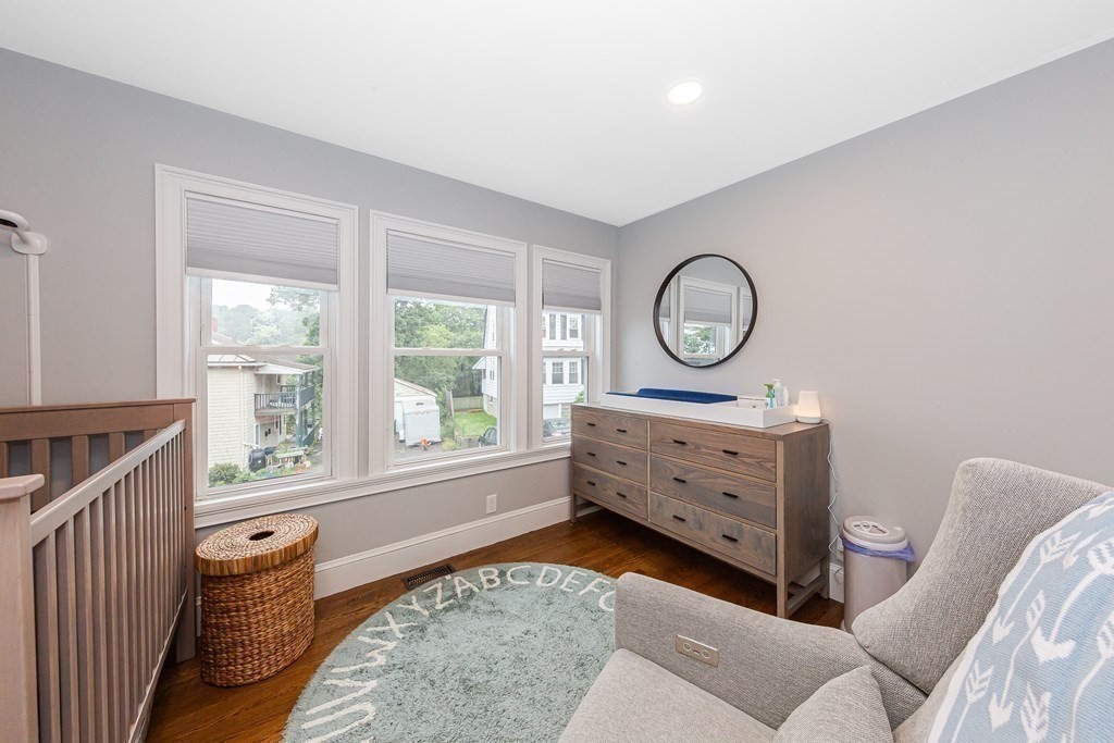 26 Foss Street, Unit 1 Medford, MA 02155 - Photo 22 of 35 a living room with furniture a bed and a window