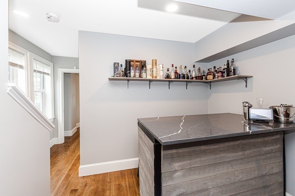 26 Foss Street, Unit 1 Medford, MA 02155 - Photo 24 of 35 a kitchen with granite countertop a sink and a stove