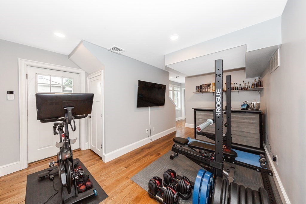26 Foss Street, Unit 1 Medford, MA 02155 - Photo 25 of 35 a living room with furniture and a flat screen tv