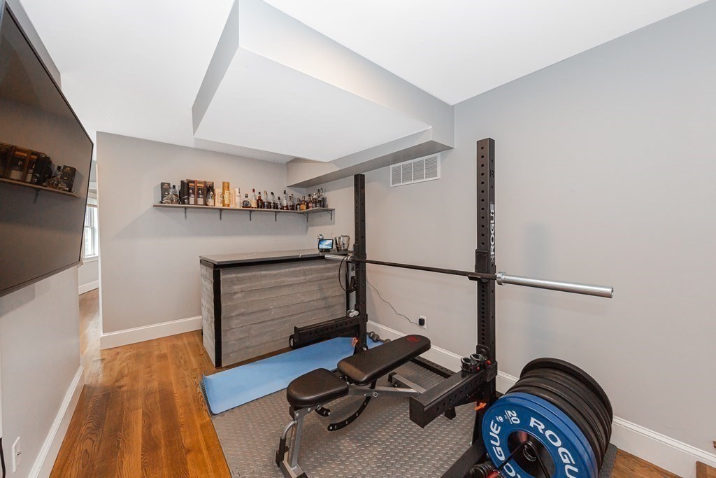 26 Foss Street, Unit 1 Medford, MA 02155 - Photo 26 of 35 a view of walk in closet with clothes and shoes