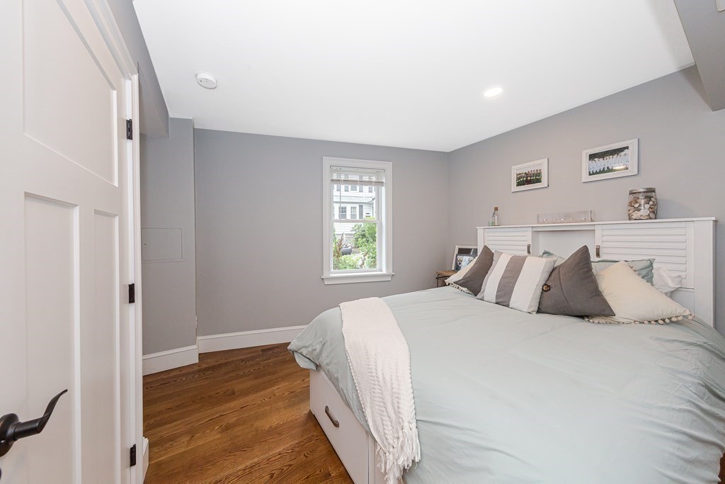 26 Foss Street, Unit 1 Medford, MA 02155 - Photo 28 of 35 a bedroom with a bed and a window