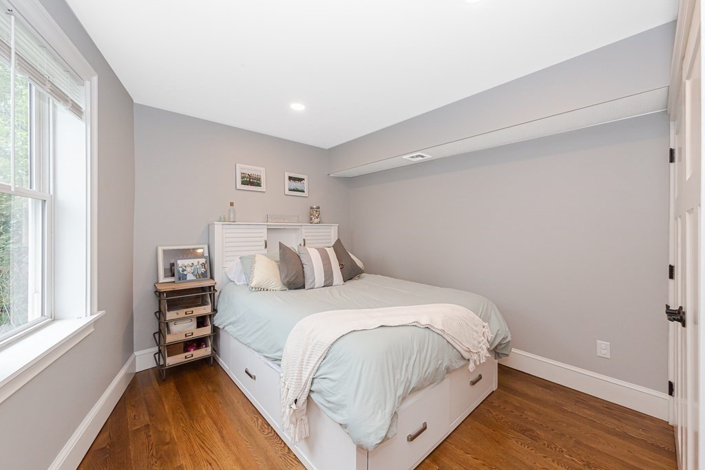 26 Foss Street, Unit 1 Medford, MA 02155 - Photo 29 of 35 a large white bed in a white room