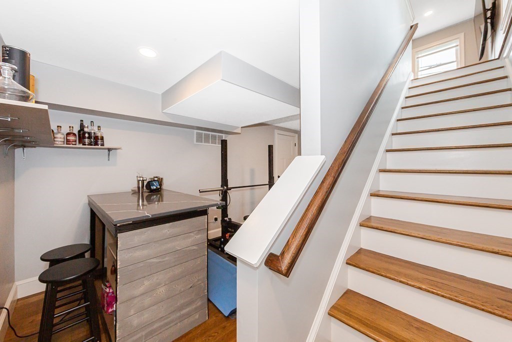26 Foss Street, Unit 1 Medford, MA 02155 - Photo 30 of 35 a view of entryway and hall with wooden floor