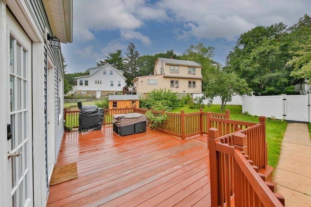 26 Foss Street, Unit 1 Medford, MA 02155 - Photo 32 of 35 a view of a chairs and table on the wooden deck