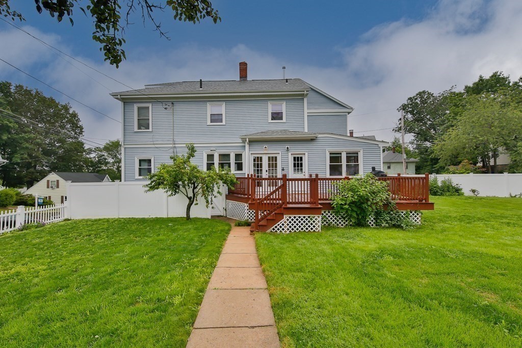 26 Foss Street, Unit 1 Medford, MA 02155 - Photo 33 of 35 a front view of house with yard and green space
