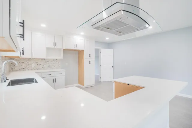 a view of a kitchen with a sink and dishwasher
