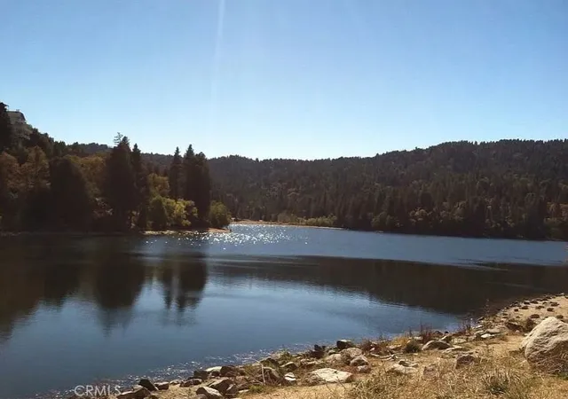 a view of a lake with mountain in the background