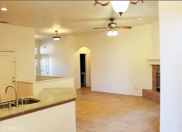 a bathroom with a granite countertop sink a mirror and a shower