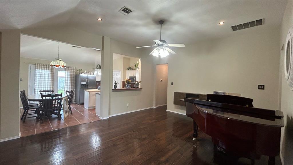 116 Lightning Trail Forney, TX 75126 - Photo 11 of 19 wooden floor and dining room with wooden floor