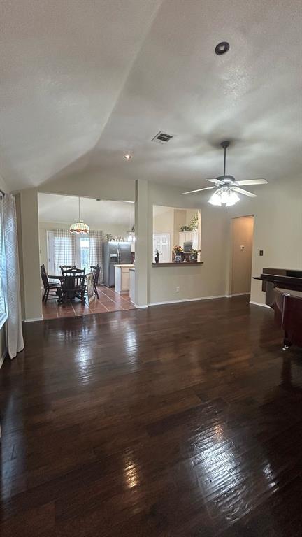 116 Lightning Trail Forney, TX 75126 - Photo 12 of 19 a view of a living room and kitchen floor to ceiling window and wooden floor