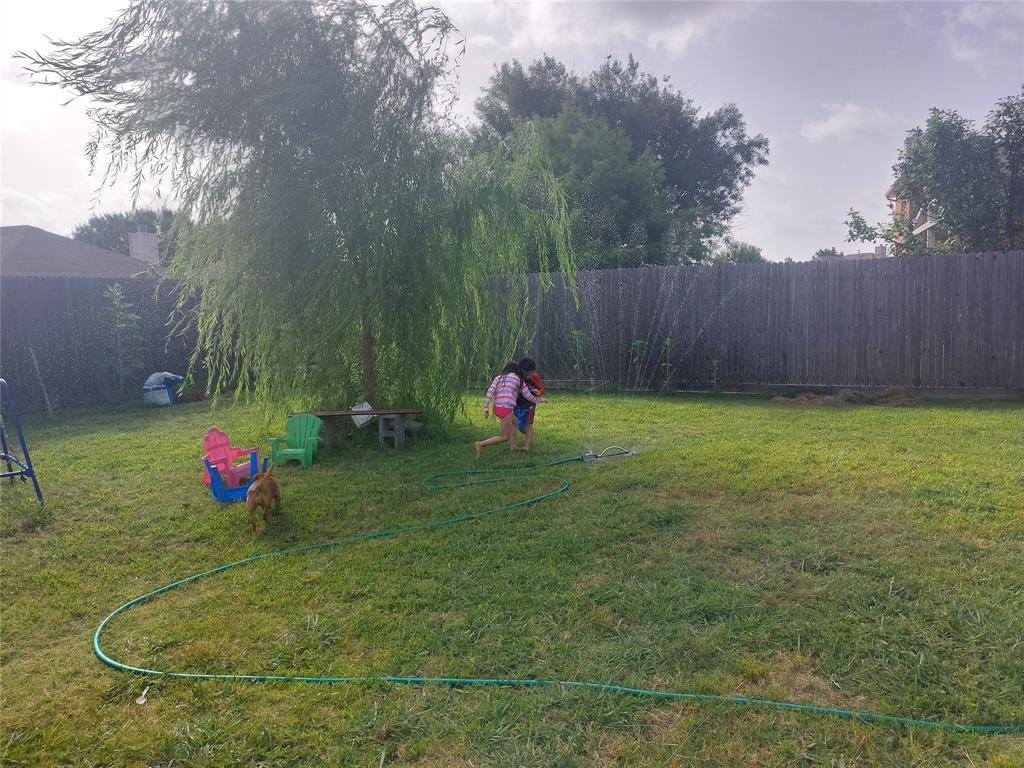 116 Lightning Trail Forney, TX 75126 - Photo 19 of 19 a backyard of a house with table and chairs