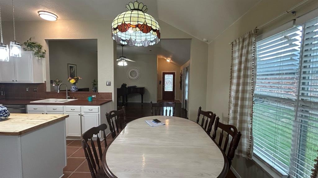 116 Lightning Trail Forney, TX 75126 - Photo 7 of 19 a view of a dining room with furniture a chandelier and wooden floor