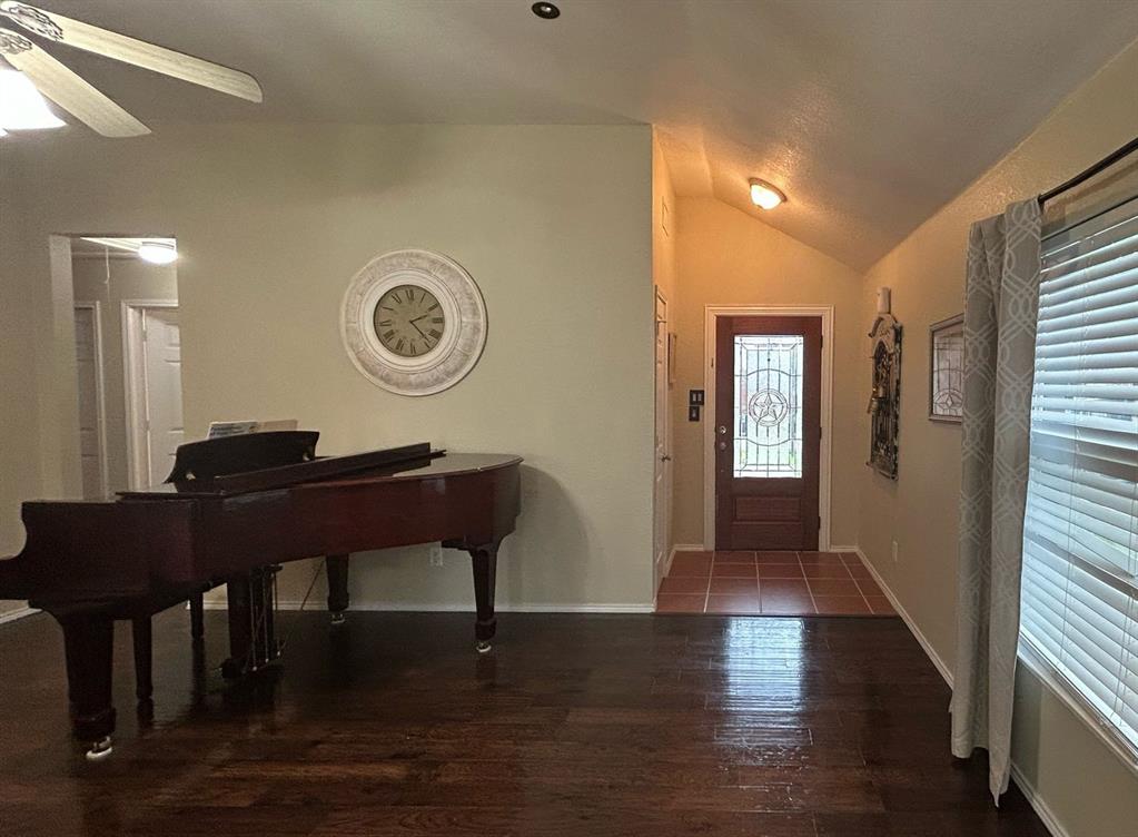 116 Lightning Trail Forney, TX 75126 - Photo 8 of 19 a living room with a table chairs and a wooden floor