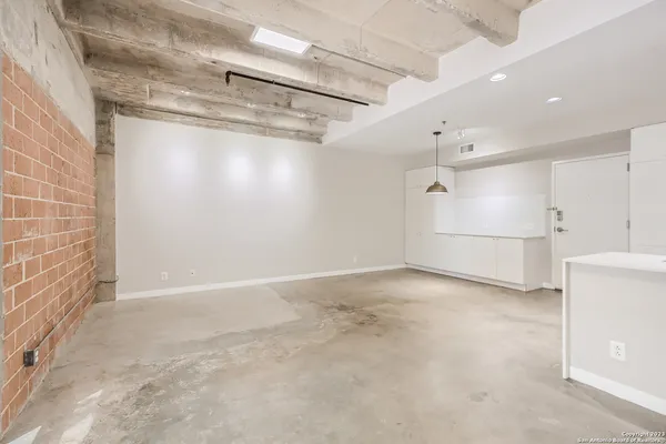 a view of empty room with windows