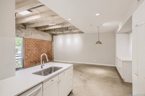 a view of a kitchen with a sink and dishwasher