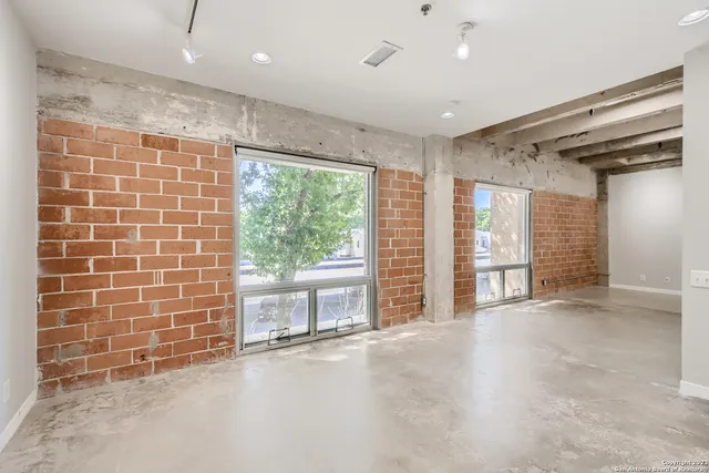 a view of an empty room with a sliding door