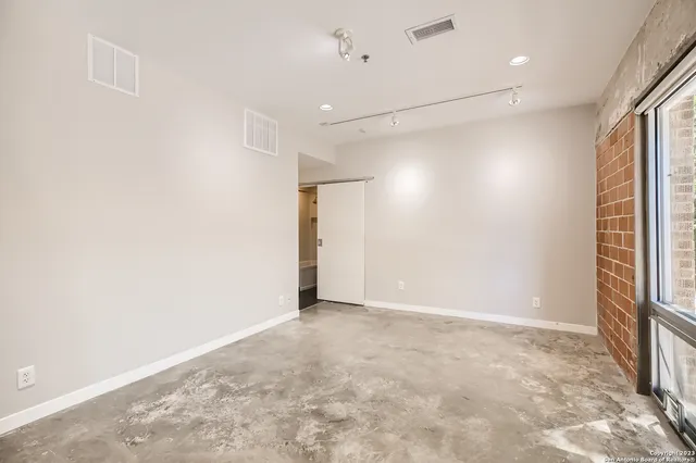 a view of a storage & utility room with dryer and washer