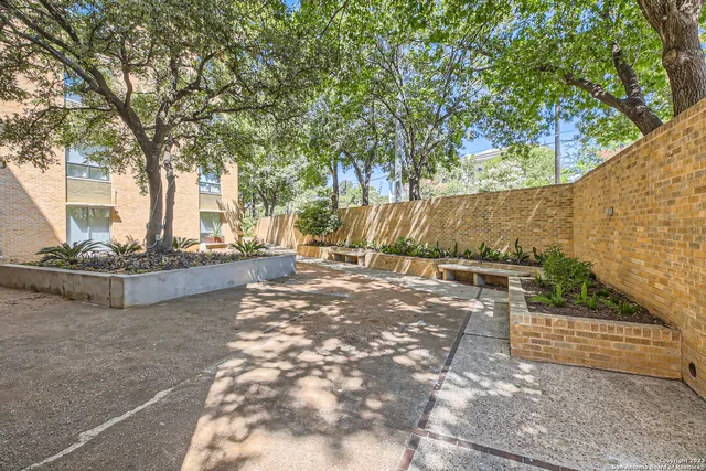 a view of a brick building with many windows
