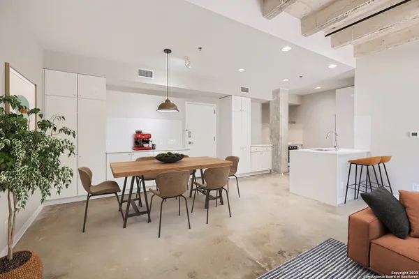 a view of a dining room with furniture