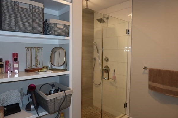 205 West 8th Street, Unit 4 Boston, MA 02127 - Photo 14 of 22 a bathroom with a shower a sink and a mirror