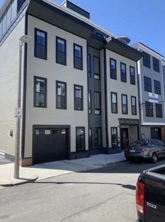 205 West 8th Street, Unit 4 Boston, MA 02127 - Photo 20 of 22 a front view of a building with a street
