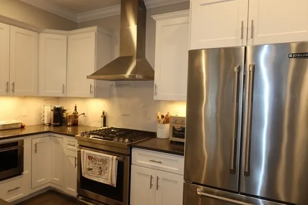 a kitchen with a stove and a refrigerator