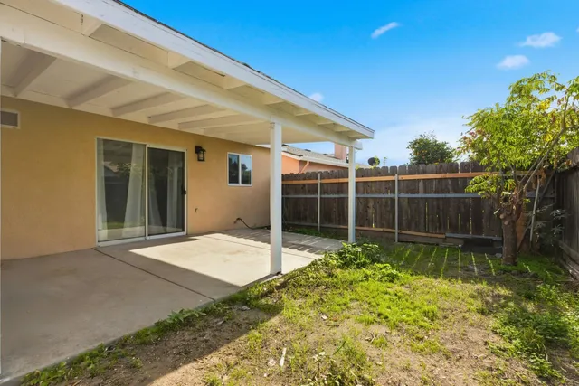 a house view with a backyard space
