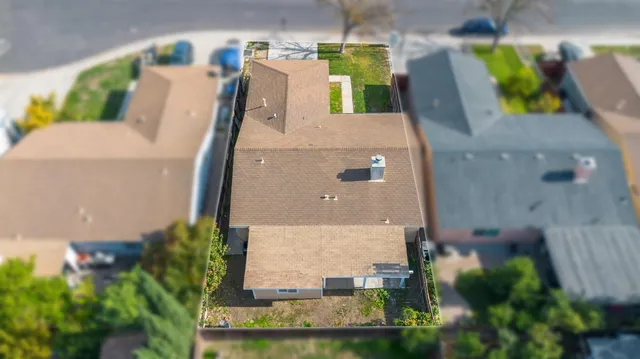 an aerial view of a house with outdoor space