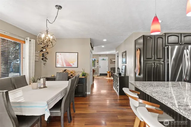 a view of a dining room with furniture and window