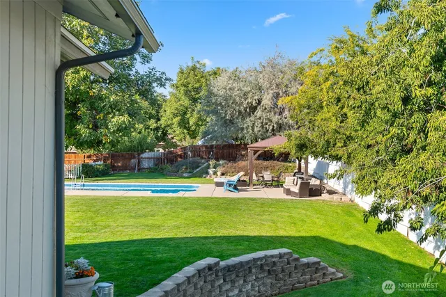 a view of a park with large trees