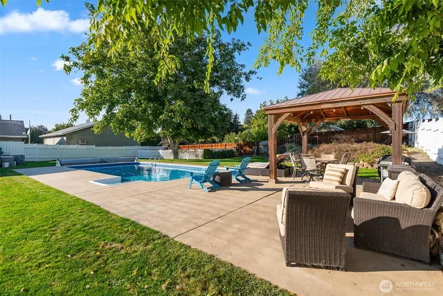 an outdoor view of the patio and swimming pool