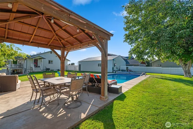 a view of yard with patio