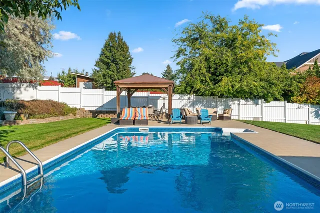 a view of a swimming pool with a patio