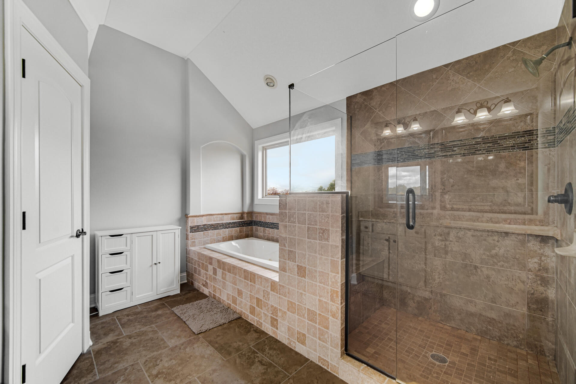 12566 Massachusetts Street Crown Point, IN 46307 - Photo 11 of 30 a bathroom with a granite countertop sink a mirror and shower