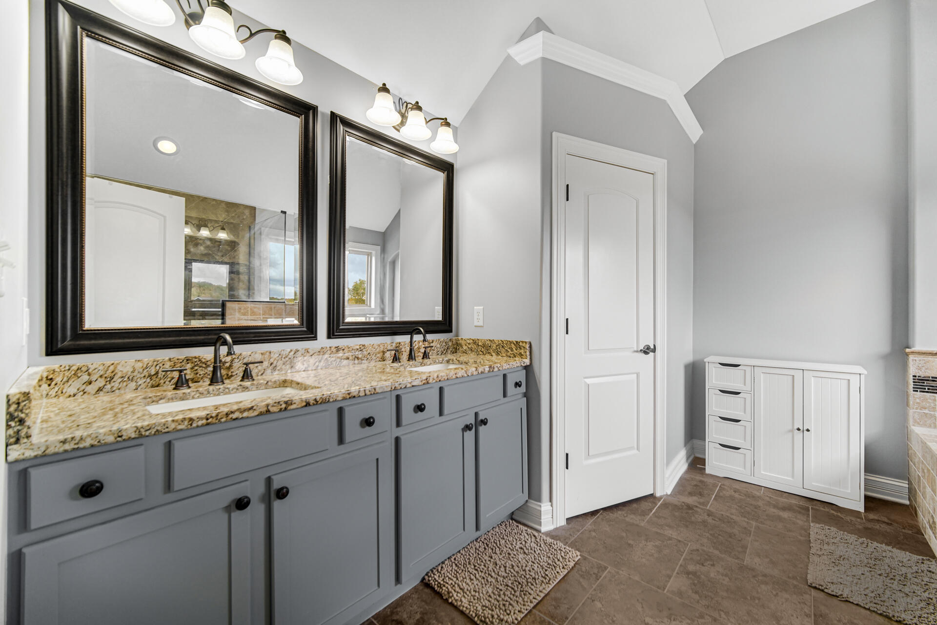12566 Massachusetts Street Crown Point, IN 46307 - Photo 12 of 30 a spacious bathroom with a granite countertop double vanity sink mirror and