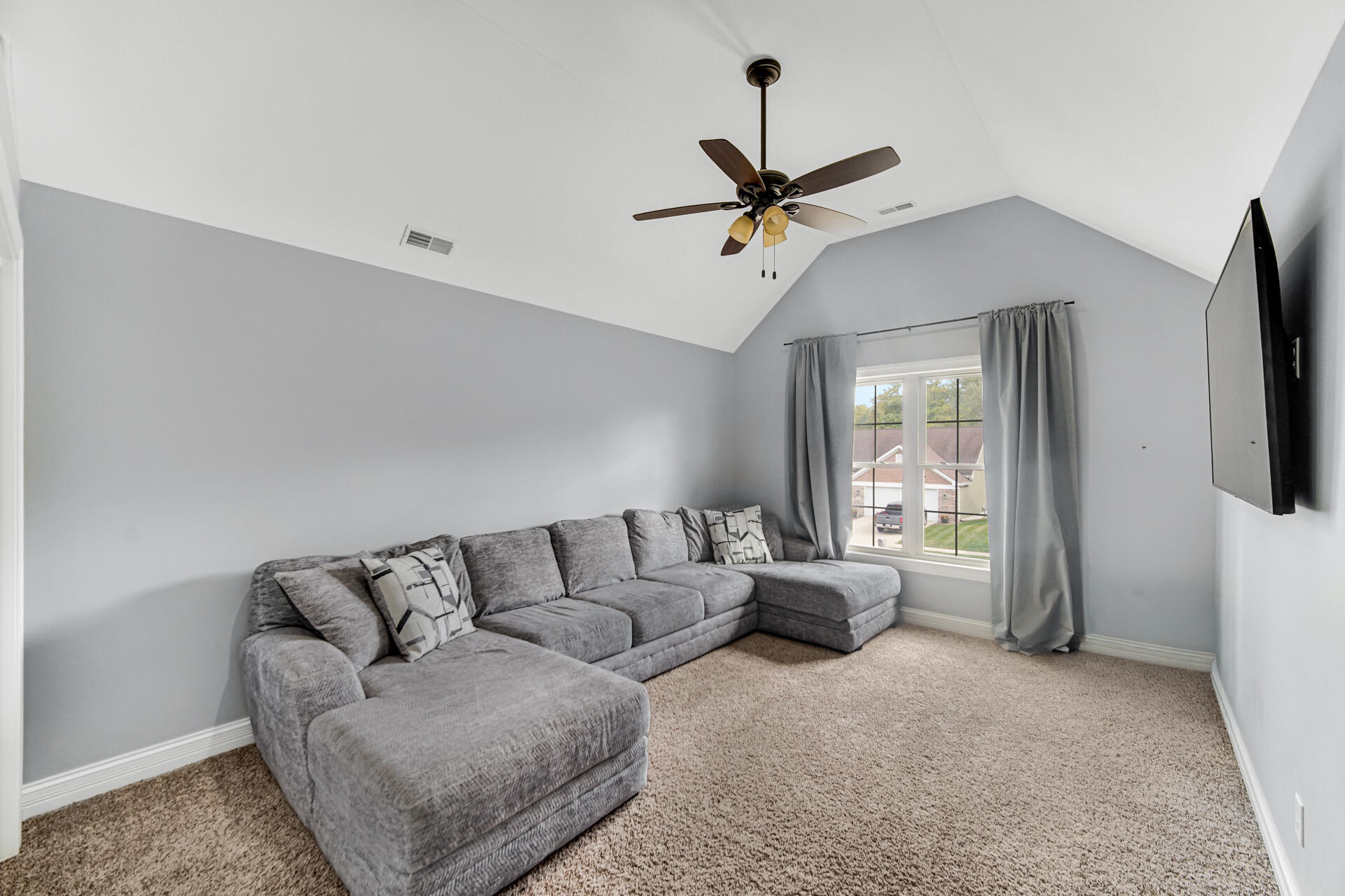 12566 Massachusetts Street Crown Point, IN 46307 - Photo 13 of 30 a living room with furniture and a flat screen tv