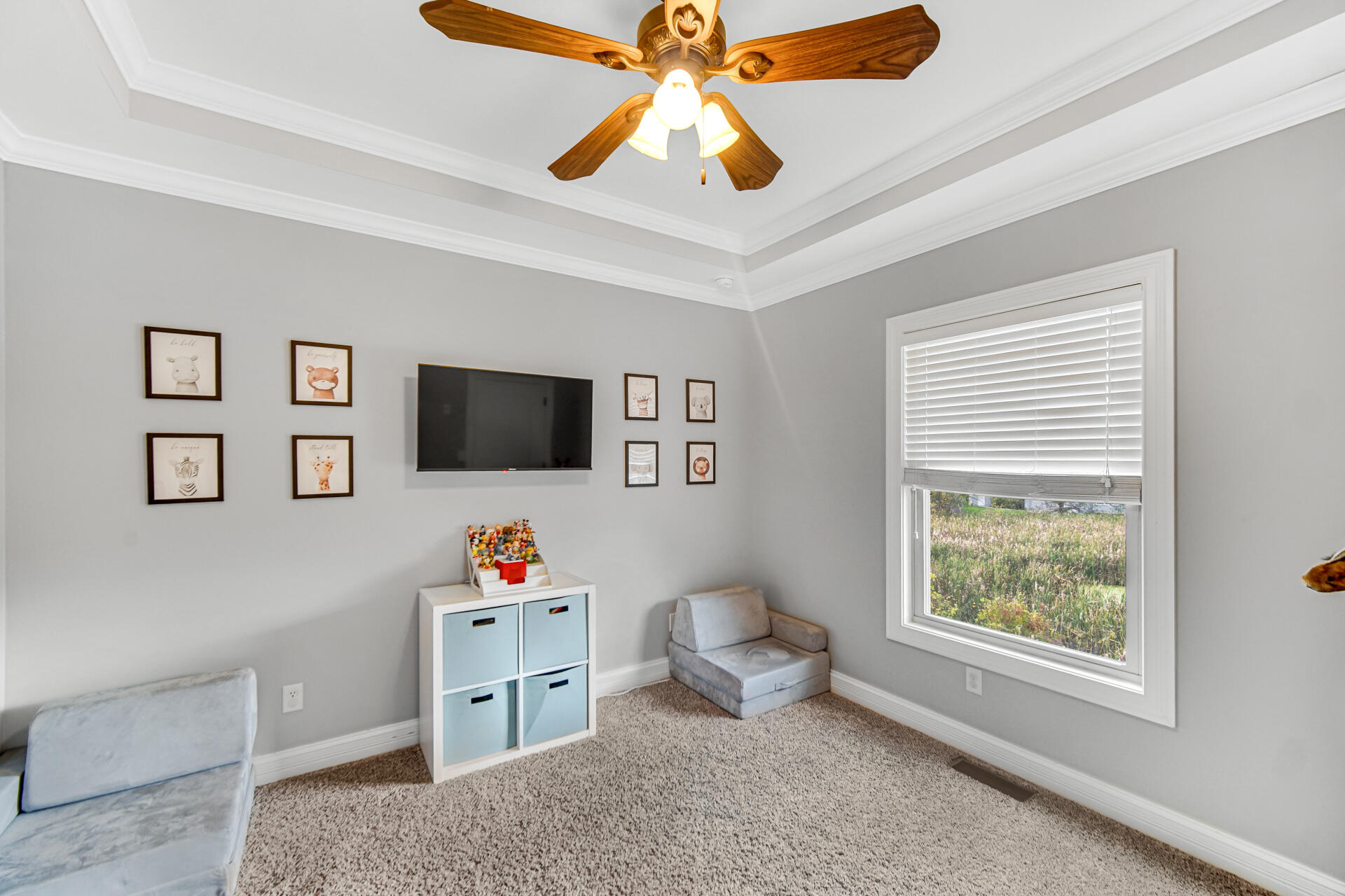 12566 Massachusetts Street Crown Point, IN 46307 - Photo 14 of 30 a living room with furniture and a flat screen tv