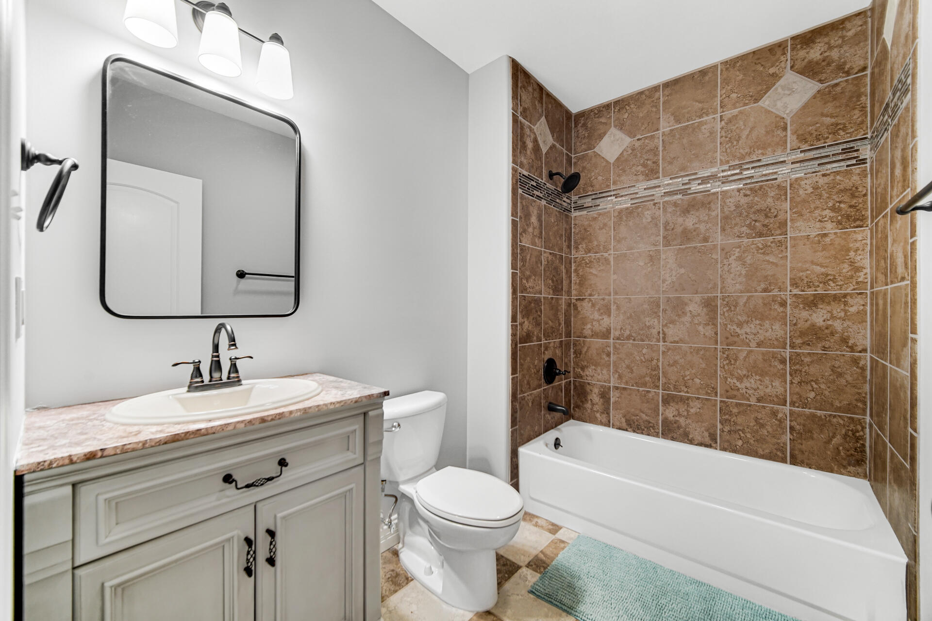 12566 Massachusetts Street Crown Point, IN 46307 - Photo 20 of 30 a bathroom with a toilet sink vanity tub and shower