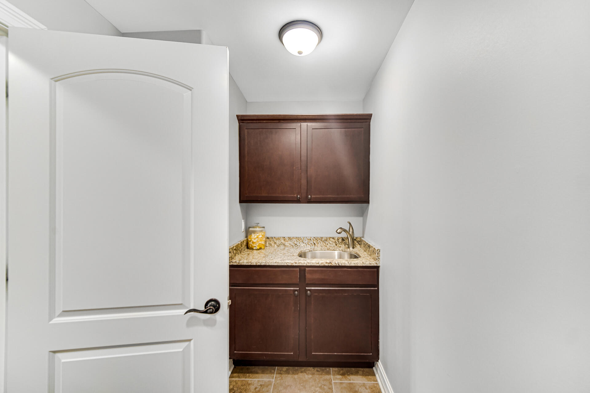 12566 Massachusetts Street Crown Point, IN 46307 - Photo 24 of 30 a bathroom with a sink and a mirror