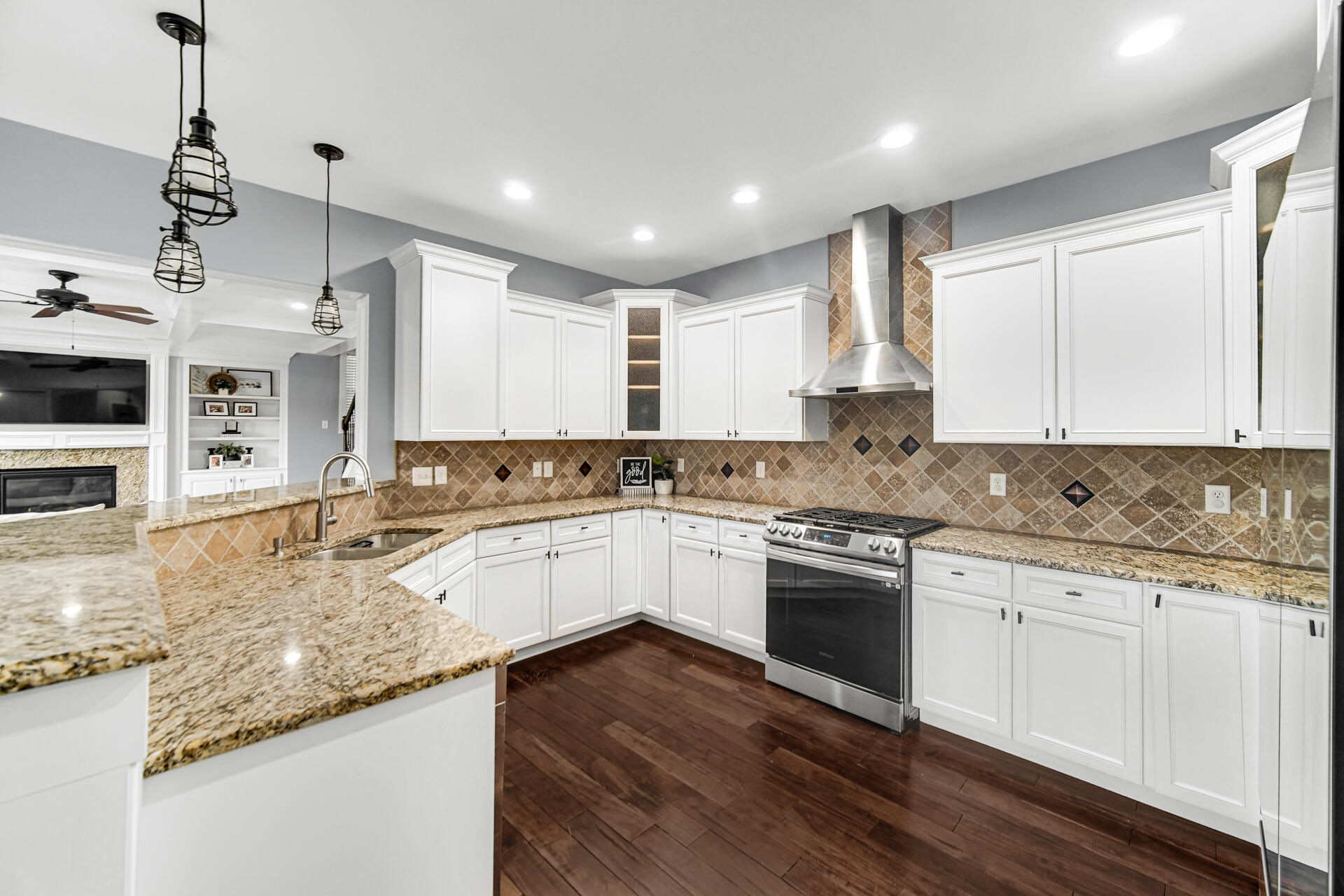12566 Massachusetts Street Crown Point, IN 46307 - Photo 7 of 30 a kitchen with stainless steel appliances granite countertop a stove sink and cabinets