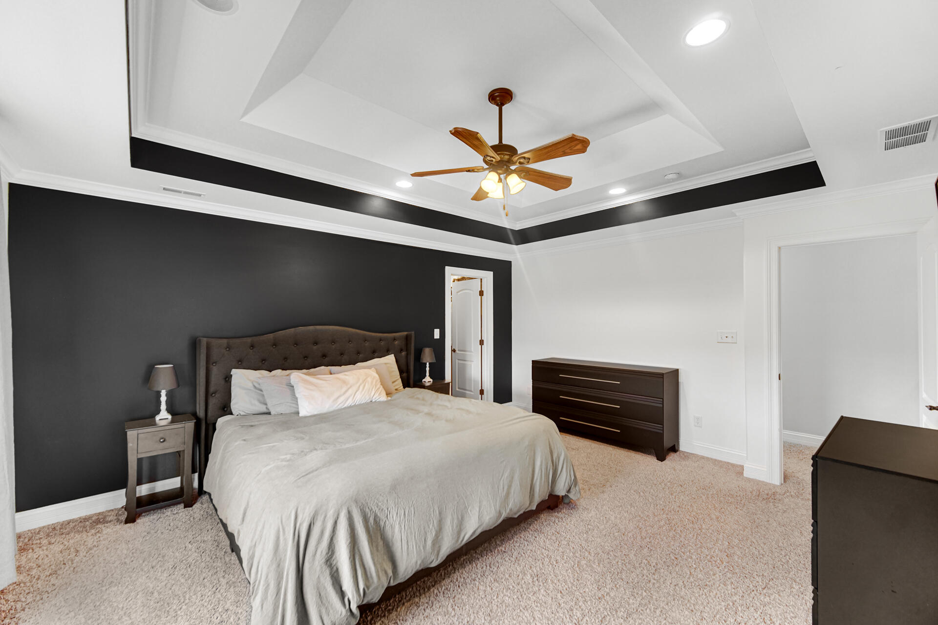 12566 Massachusetts Street Crown Point, IN 46307 - Photo 9 of 30 a bedroom with a bed and a chandelier