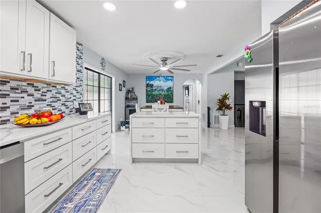 a hallway with cabinets and window