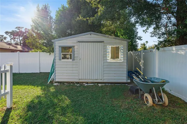 a view of a backyard with a sitting area