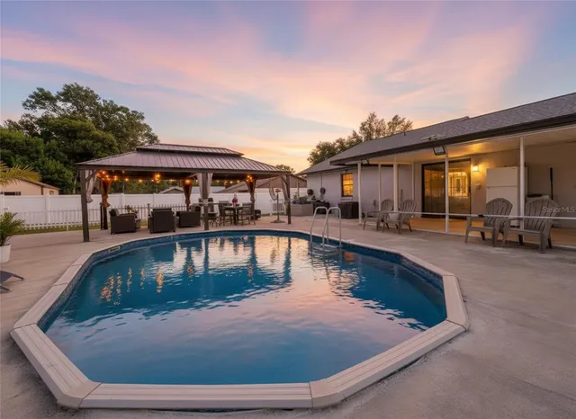 a view of a house with swimming pool