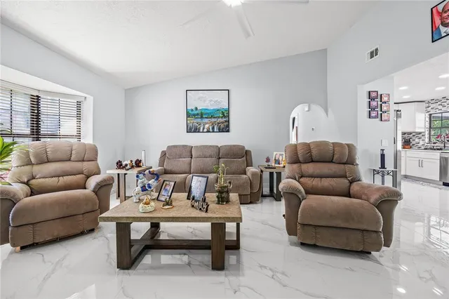 a living room with furniture a rug and a couch